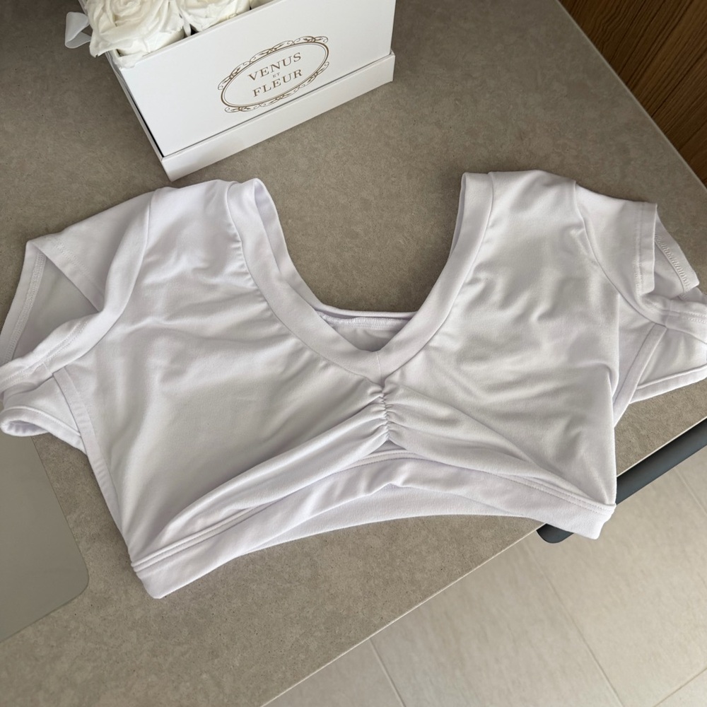 Bombshell Sportswear Flex V-Neck
Open Back Crop Tee White